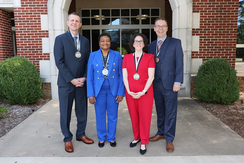 2024 Odyssey Medalists Alan Tackett, Cabrina Campbell, Amanda Brooks, and Daniel Ellis. Not pictured: Lorraine Berry Woodward.